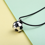 Bola Elyo ballon de foot sur cordon noir, fond jaune et vert d’eau