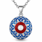 Bola de grossesse Nahia, motifs blancs sur bleu roi et centre nacré cerclé de rouge, sur chaîne argentée